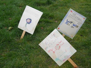 Signs on grass small